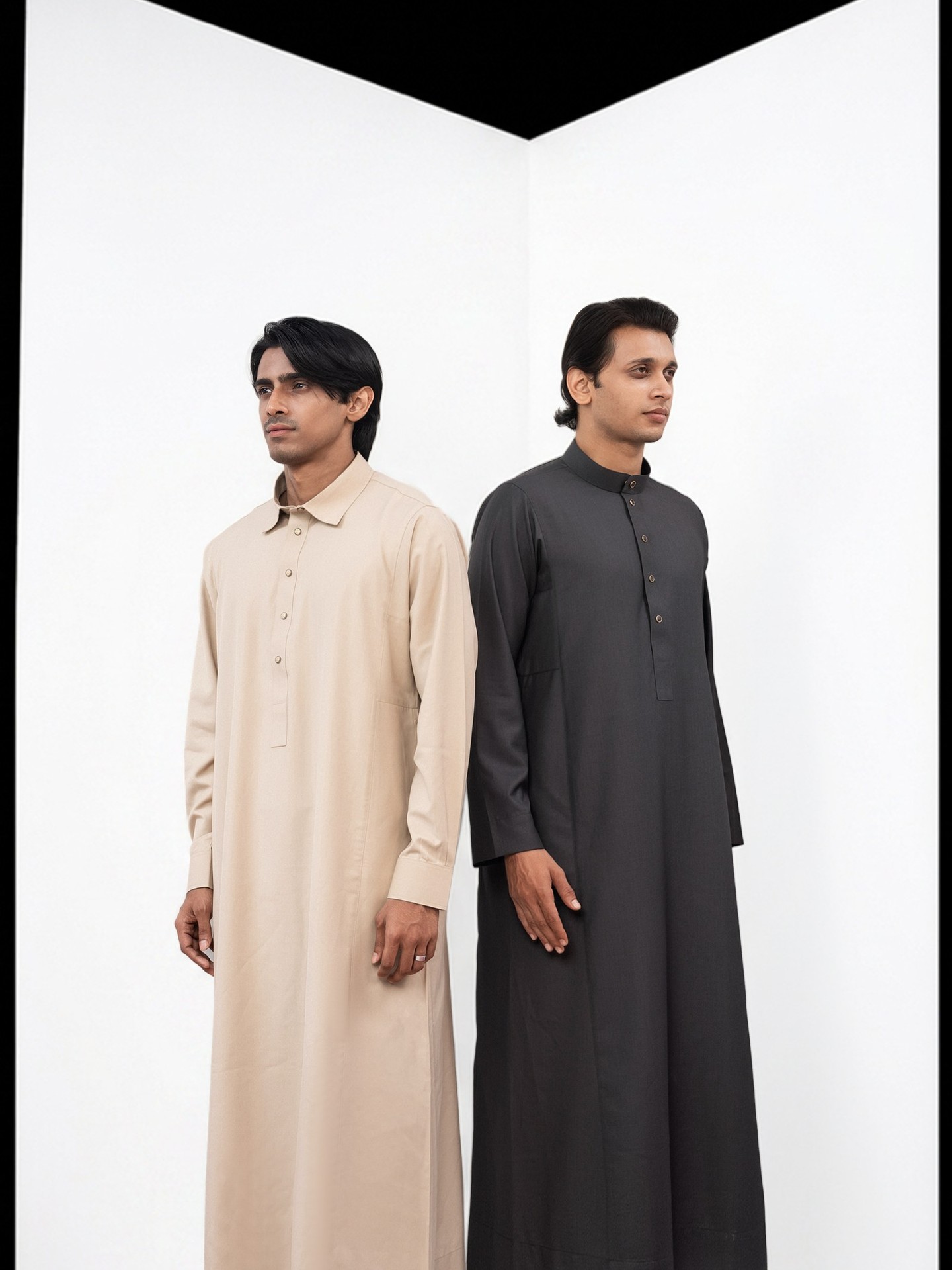Two men in VIOR thobes in the white studio set