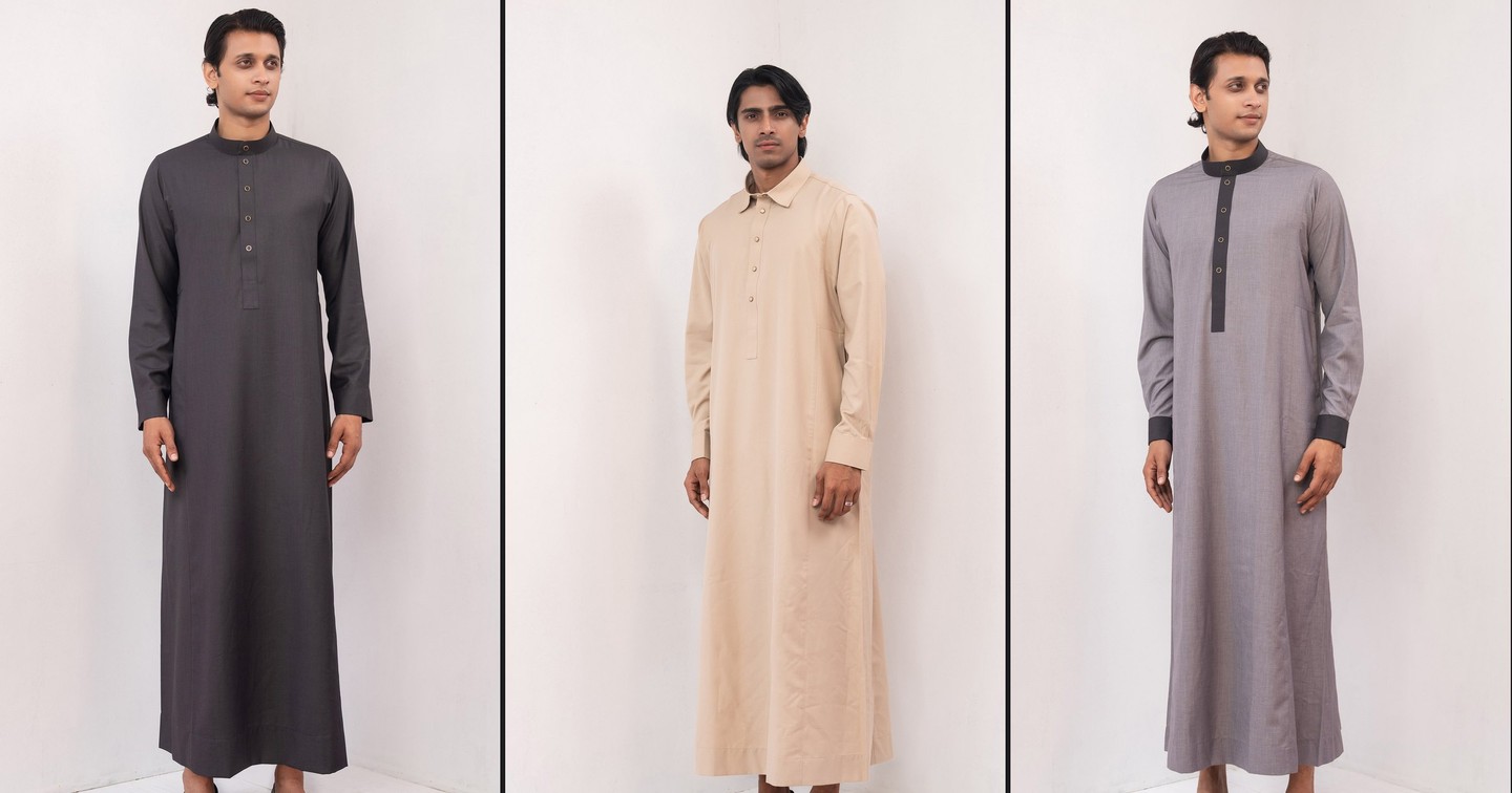 Three VIOR thobes in the white studio — graphite, sand and grey